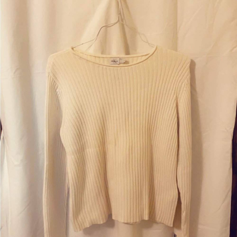 Calvin Klein Jeans brand sweatshirt in an off white/cream color.